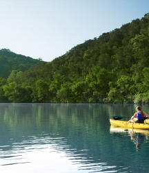 A canoeing couple in Lake Austin Spa Resort