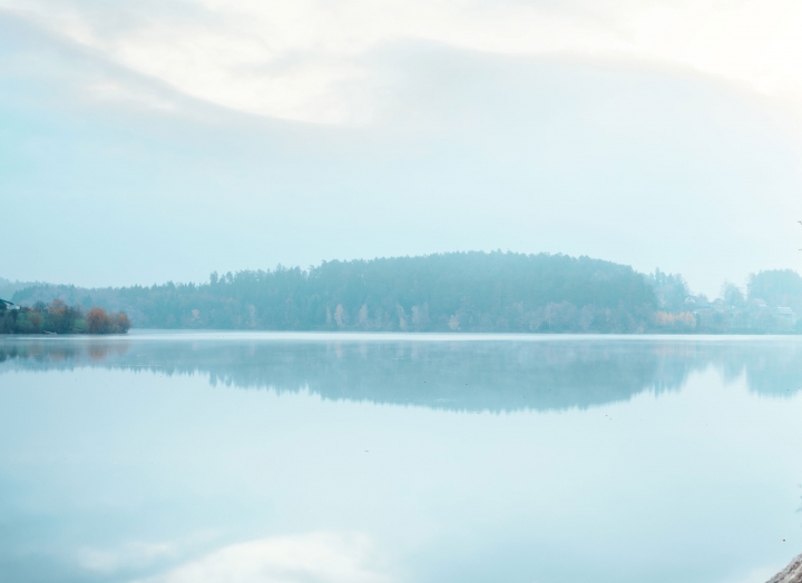 A panoramic shot of Lake Austin on a calm, misty morning