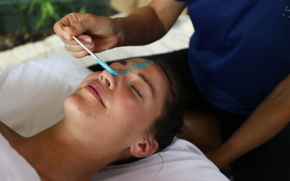 Woman receiving facial at Spa