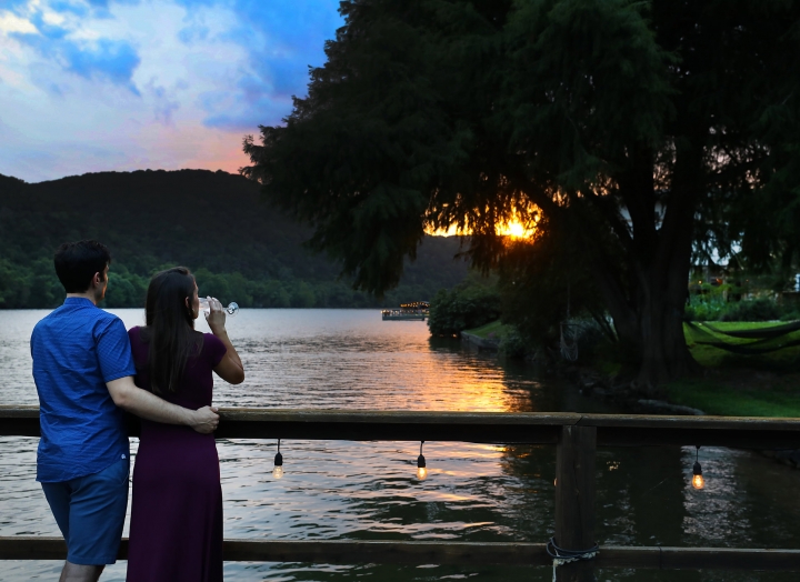 couple watching sunset on dock