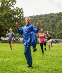 Tai Chi class outdoor with the lake in the back