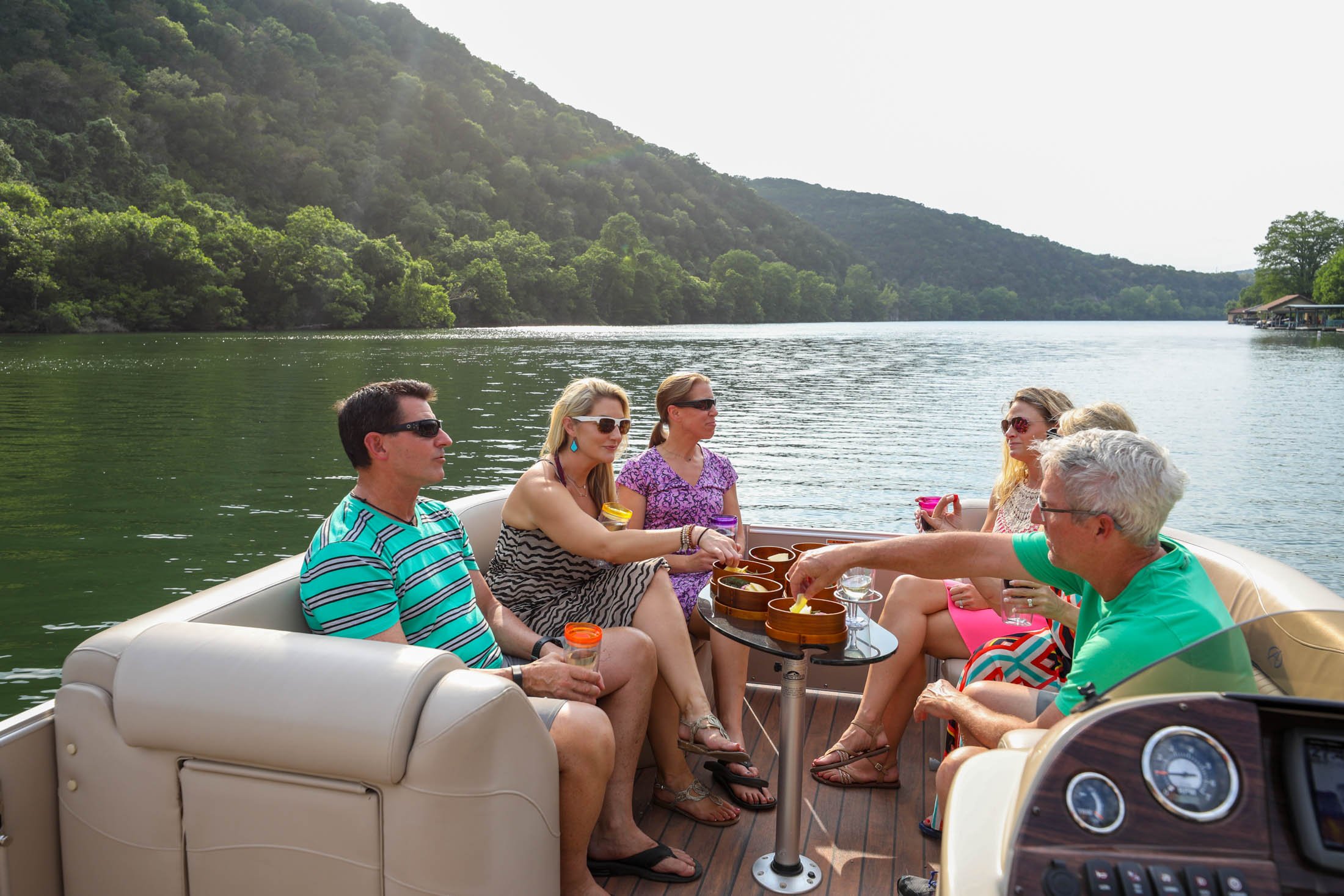 Six people having a good time with the boat cruise experience