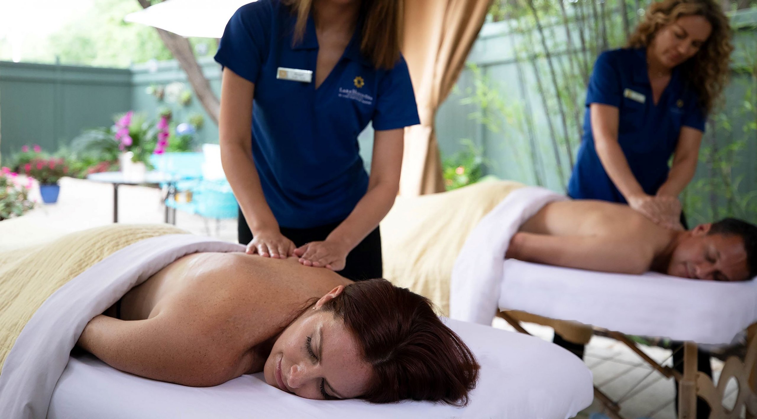 A woman and a man getting a back massage at Lake Austin Spa Resort