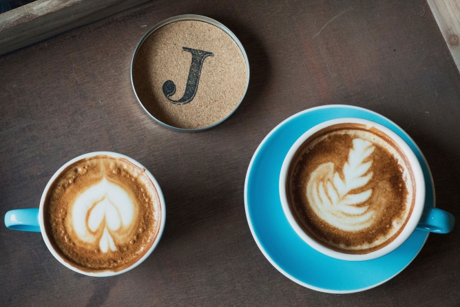 Two latte coffee's in blue mugs from the Lakeside Dessert and Coffee Bar at Lake Austin