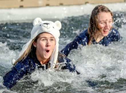 Two women completing the polar bear plunge at Lake Austin Spa Resort