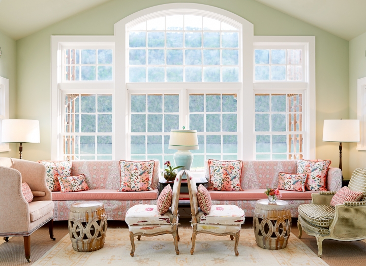 Couches and chairs in front of the floor-to-ceiling and lake-facing library windows.