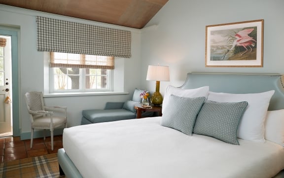California King Bed with Chair, Lounger under window in Luxury Garden View Room