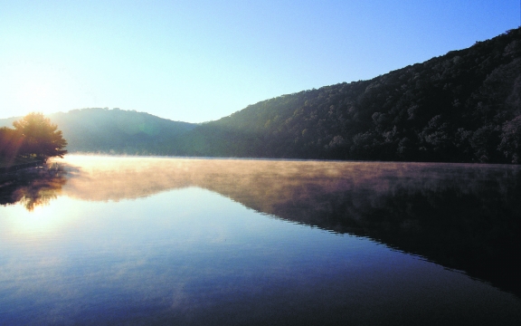 sun rises over Lake Austin