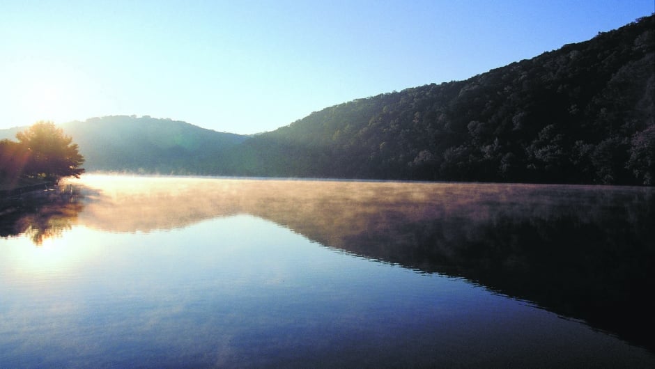 sun rises over Lake Austin