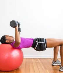 Dumbbell chest press on swiss ball