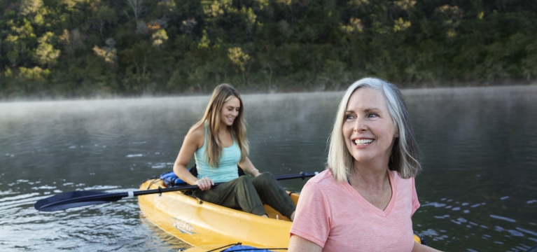Mother and daughter kayaking at sunrise at Lake Austin Spa Resort