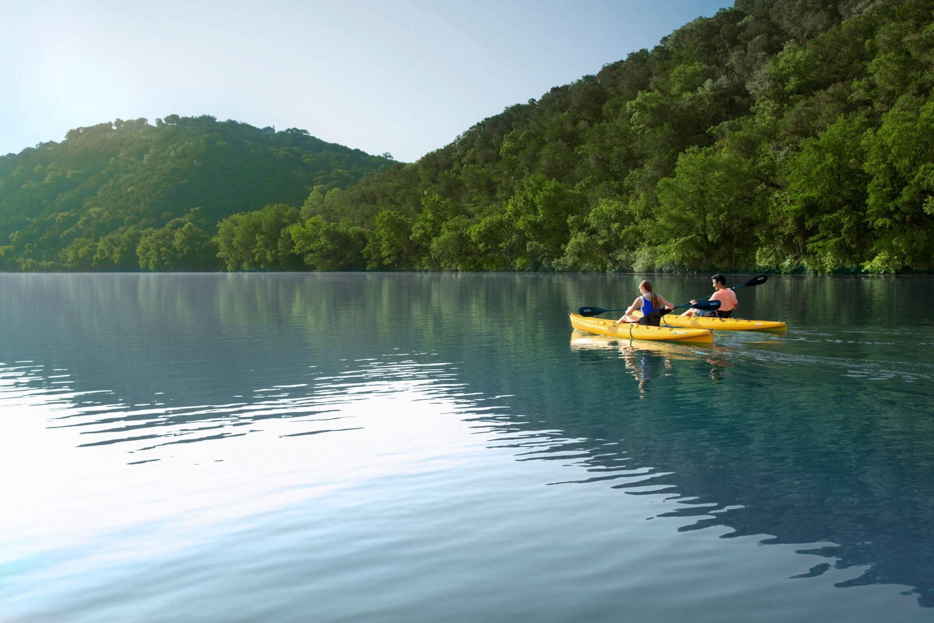 Two people kayaking in lake