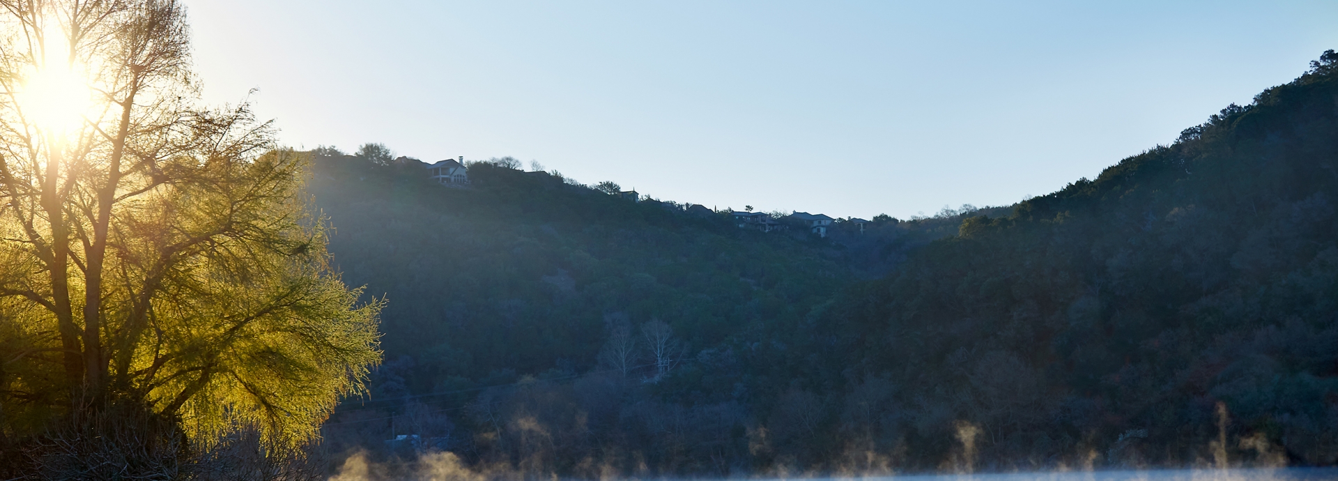 Morning fog over the lake at sunrise