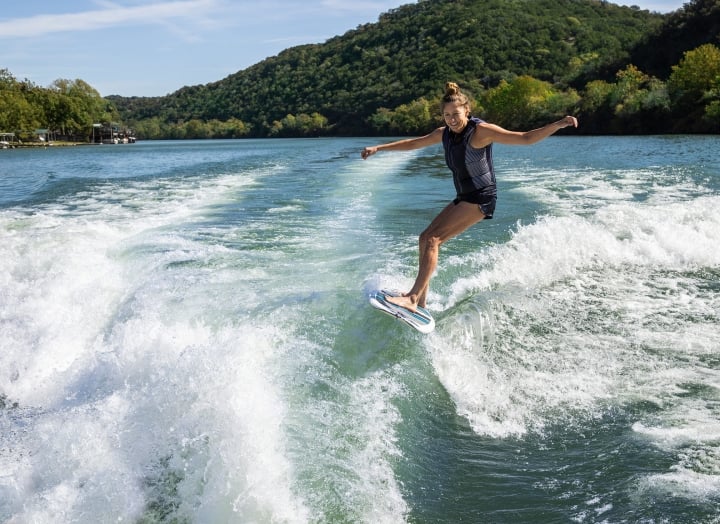 A woman wake surfing