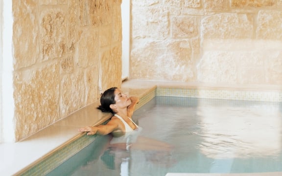 A woman in hot tub enjoying her time
