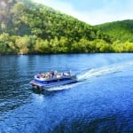 pontoon party boat cruising on Lake Austin