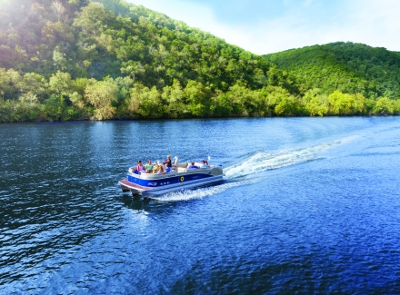 pontoon boat cruising on Lake Austin