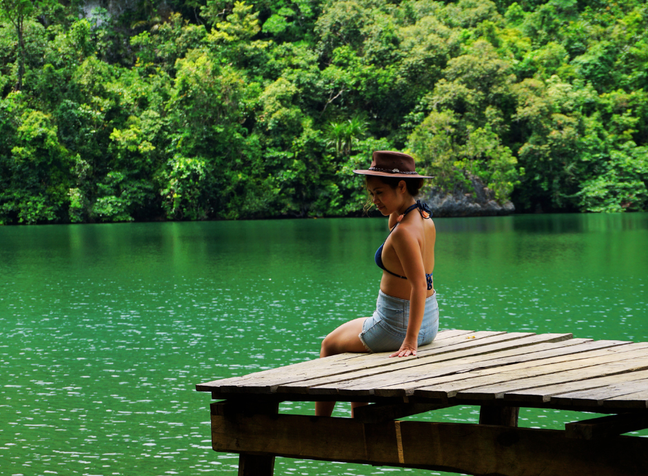 A woman relaxing on the dock