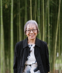 Grace is smiling at the camera