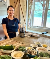 Chef Susie smiling by the blender
