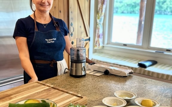 Chef Susie smiling by the blender