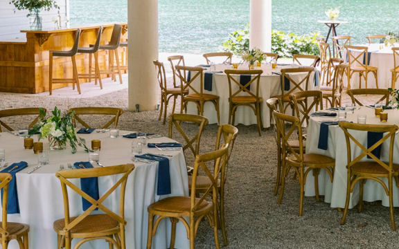 Tables and chairs are arranged for a group event at the Lake Lounge